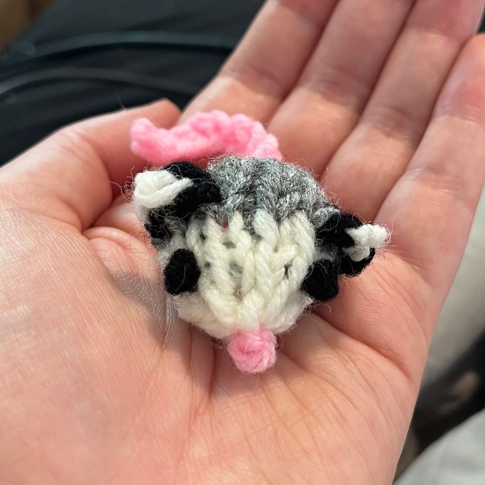 Tiny knitted baby opossum